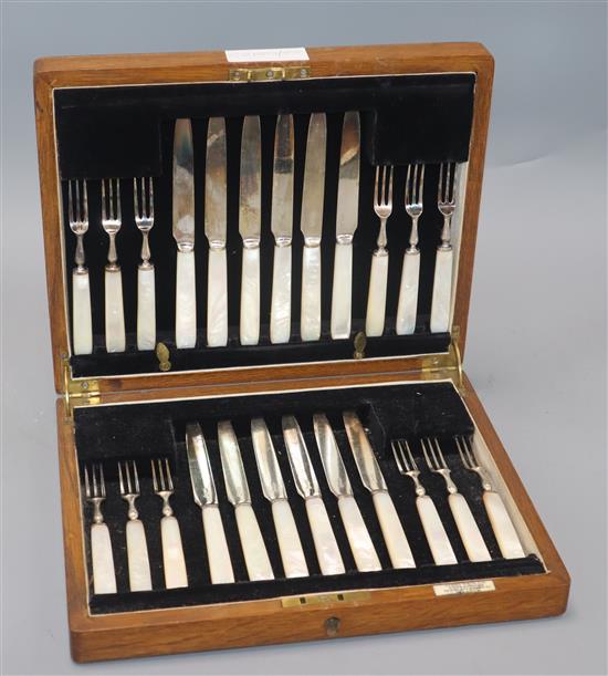 A cased set of twelve pairs of plated dessert knives and forks, with mother of pearl handles